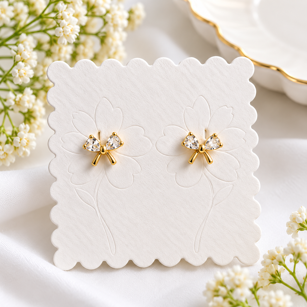 Gold-Plated Crystal Bow Ball Back Earrings